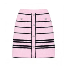 Pink striped button-up knit skirt with black trim and embellished buttons.