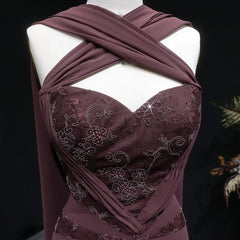 Detail of the intricate embroidery on the bodice of a halter neck chiffon evening dress.
