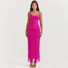 Woman wearing a bright pink dress on a white background