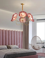 Modern bedroom with pink floral chandelier, bed, and hanging chair.