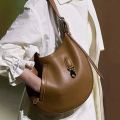 A woman stylishly carrying the crossbody bag, showcasing its versatility and size.