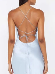 Light blue dress with criss-cross back design on a white background