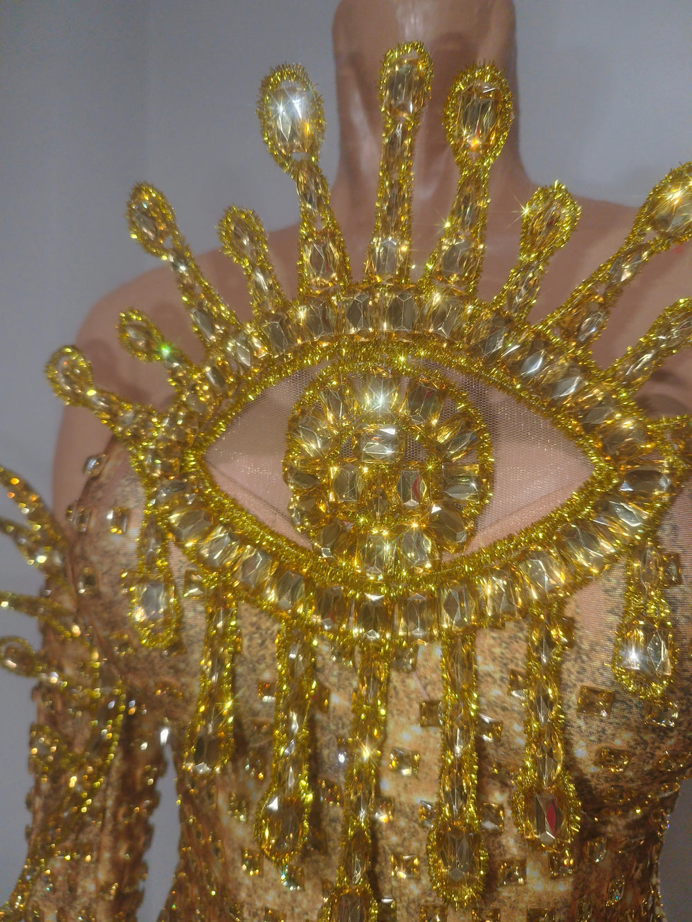 Detail of rhinestone eye and bodice on bodysuit