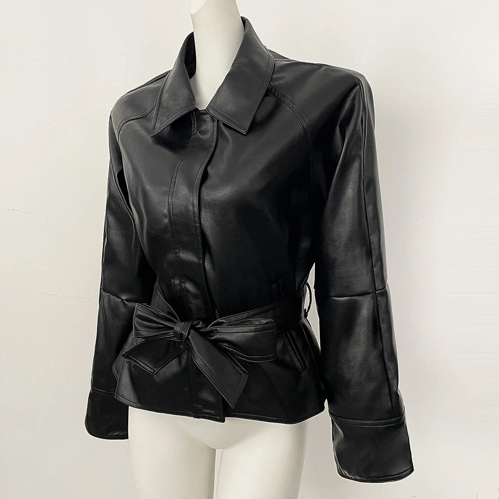 Black faux leather jacket with belt detail on a mannequin