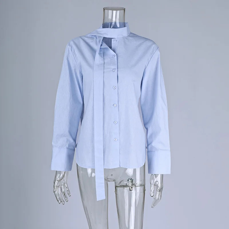 Light blue shirt on a transparent mannequin against a gray background