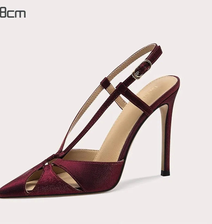 Maroon high-heeled sandal on a light gray background