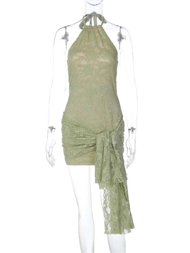Green lace dress on a mannequin against a white background