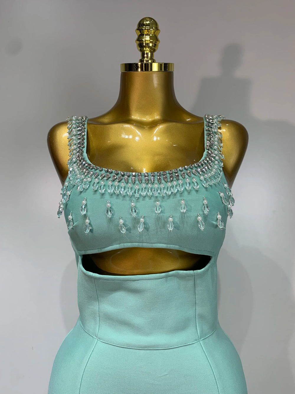 Close-up of the beaded embellishments on the square neckline