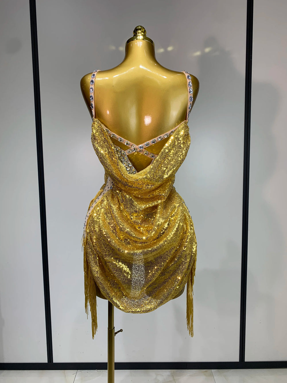 Back view of gold sequin cowl neck bodysuit