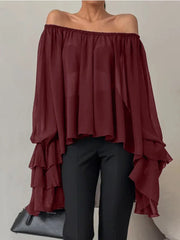 Maroon off-shoulder top with ruffled layers worn by a person on a neutral background