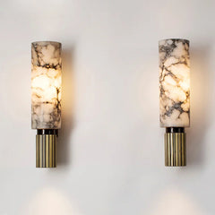 Close-up of a luxury marble wall sconce highlighting its natural veining and polished surface. B