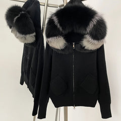 Black jacket with fur-lined hood and cuffs on a mannequin against a white background