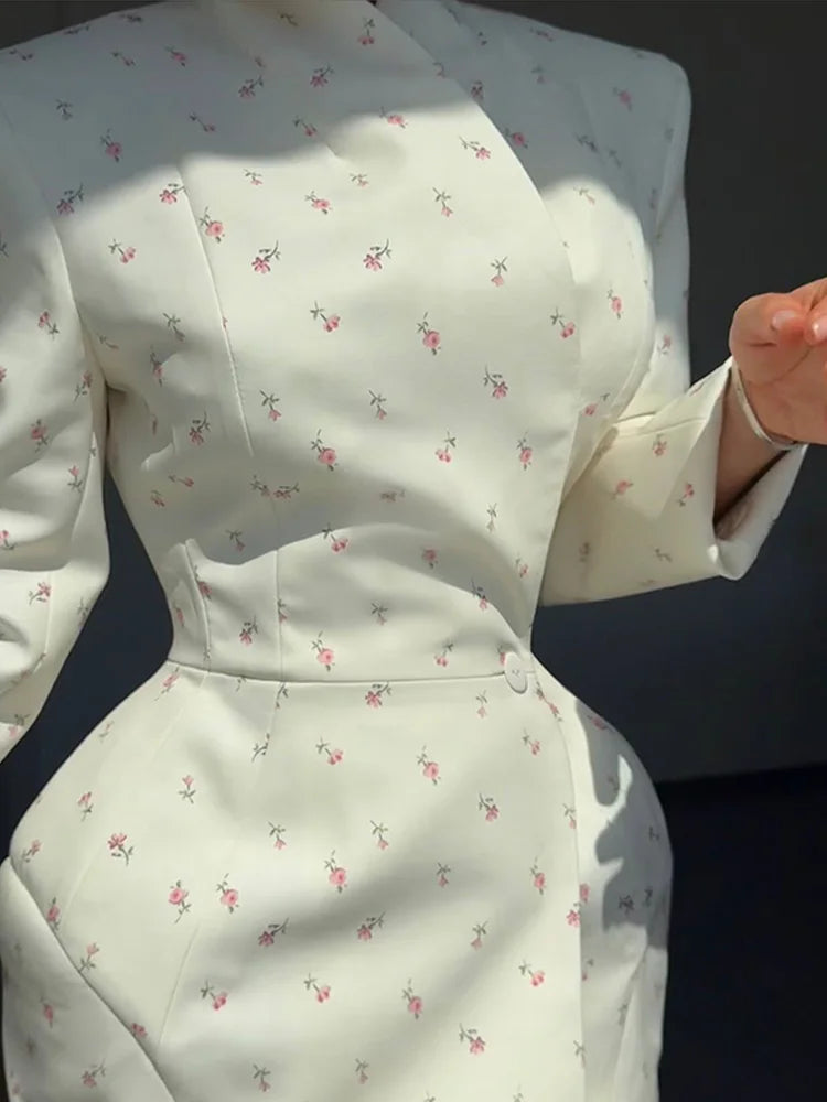 White dress with floral pattern on a dark background