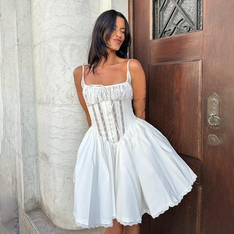 Woman wearing a white lace corset camisole mini dress with square neckline and flared A-line skirt, styled for summer