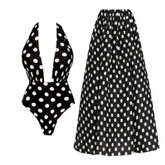 Black and white polka dot halter neck one-piece swimsuit with a matching flowing maxi skirt