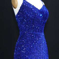 Blue sequin dress on a mannequin against a black background