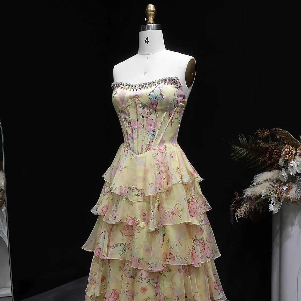 Floral dress on a mannequin against a black background