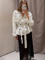 Polka dot belted trench coat full body view