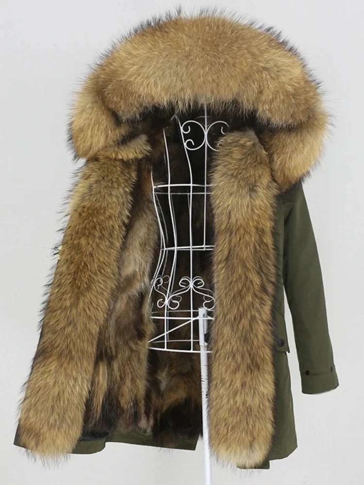 Green coat with fur hood on a mannequin against a white background