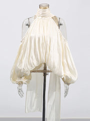 White blouse with puffed sleeves on a mannequin against a white background