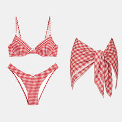 Red gingham ruffled bikini and skirt set with white trim.