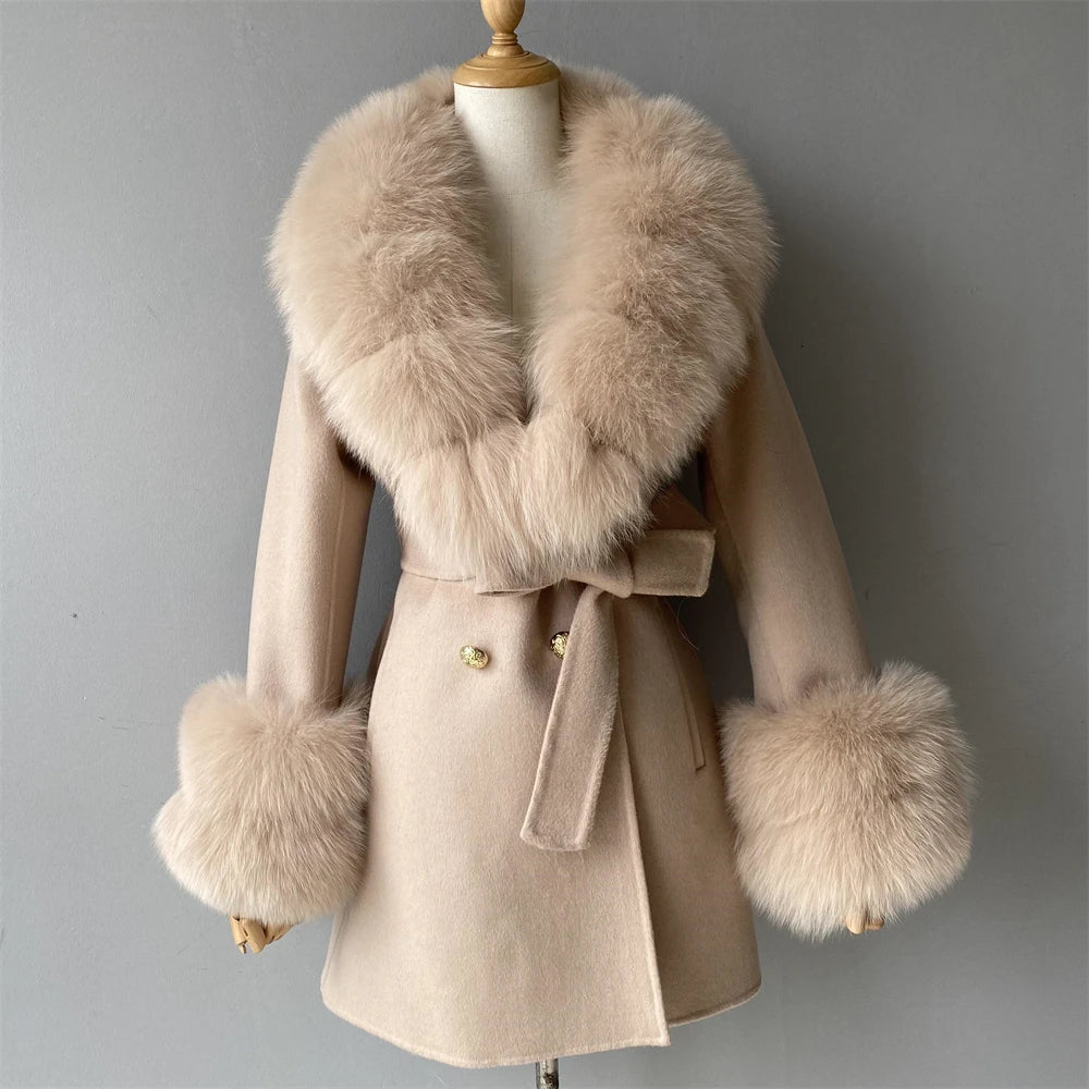 Beige coat with fur accents on a mannequin against a gray background