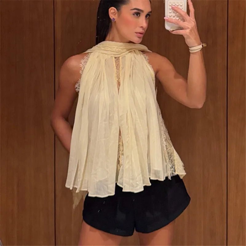 Woman wearing a pleated halter neck sleeveless top