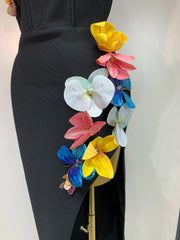 Back view of a strapless black bodycon dress