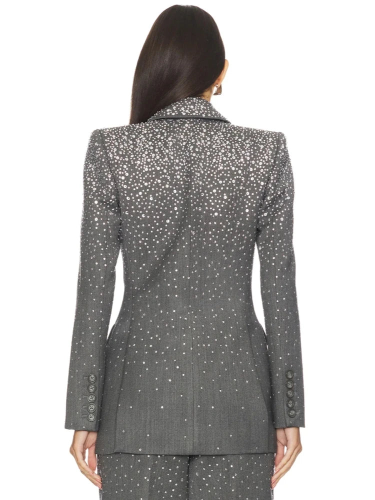 Back view of the grey crystal-embellished blazer, highlighting the crystal pattern on the shoulders and sleeves.