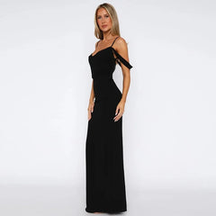 Woman wearing a black one-shoulder evening gown on a white background
