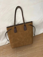 Back view of brown tote bag with adjustable straps