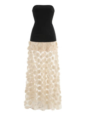 Dress with black bodice and white petal skirt on a white background