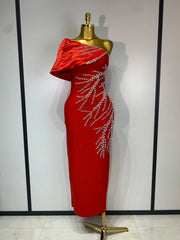 Red one shoulder dress with draped neckline detail