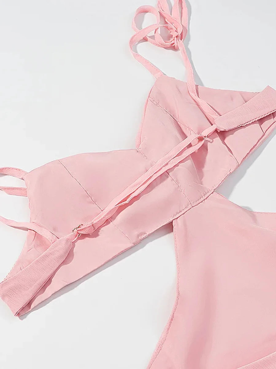 Pink bikini set on a light gray background