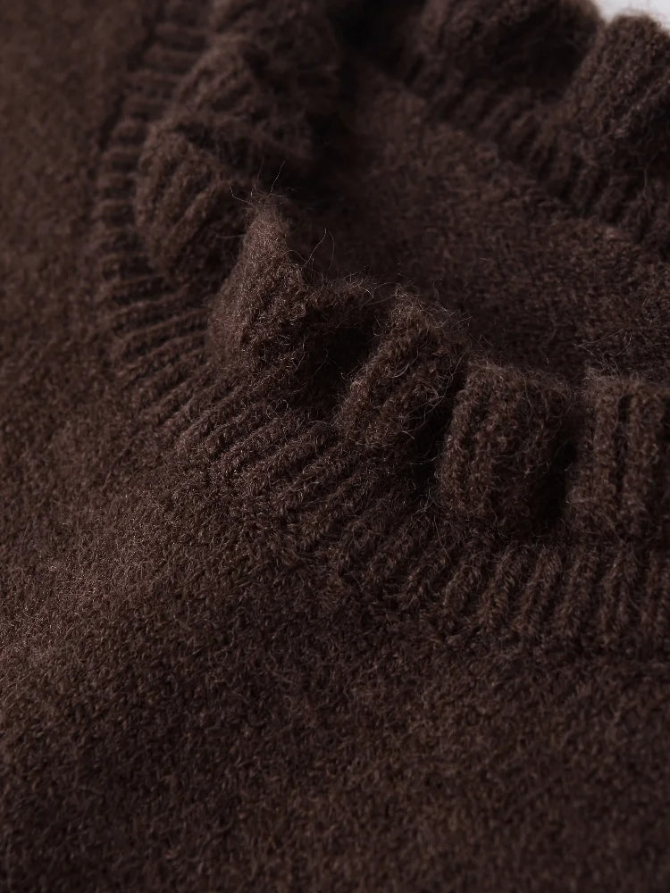 Close-up of brown knitted fabric with a textured pattern
