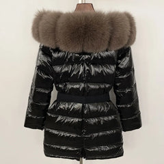 Black puffer jacket with a large fur hood on a mannequin against a white background