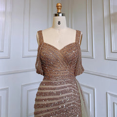 Mannequin displaying the caramel mermaid evening gown, showcasing its flattering silhouette and flowing train. Golden Atelier 4