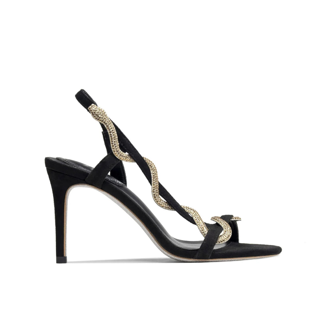 Side view of black stiletto sandals with a shimmering rhinestone strap.