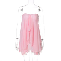 Pink strapless dress on a mannequin against a white background