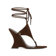 Brown wedge sandal with lace-up design on a white background
