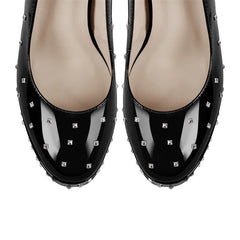 Top view of black studded patent leather pointed toe heels