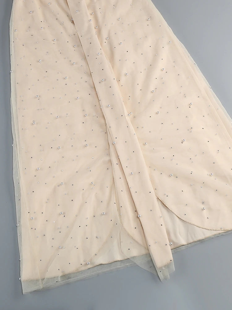 Beige fabric with small patterns on a gray background