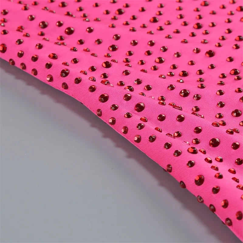 Pink fabric with red rhinestones on a white background