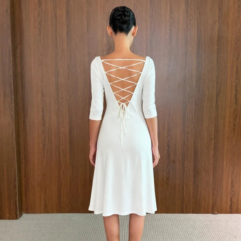 Back view of a white midi dress with lace-up detail