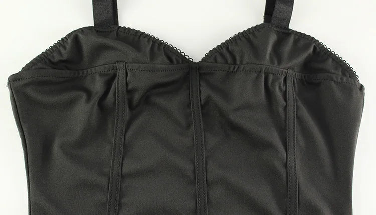 Black strapless top on a white background