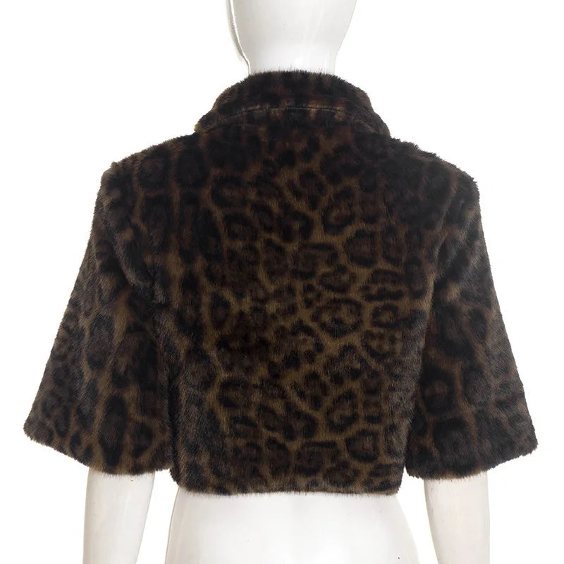 Leopard print fur jacket on a mannequin against a white background