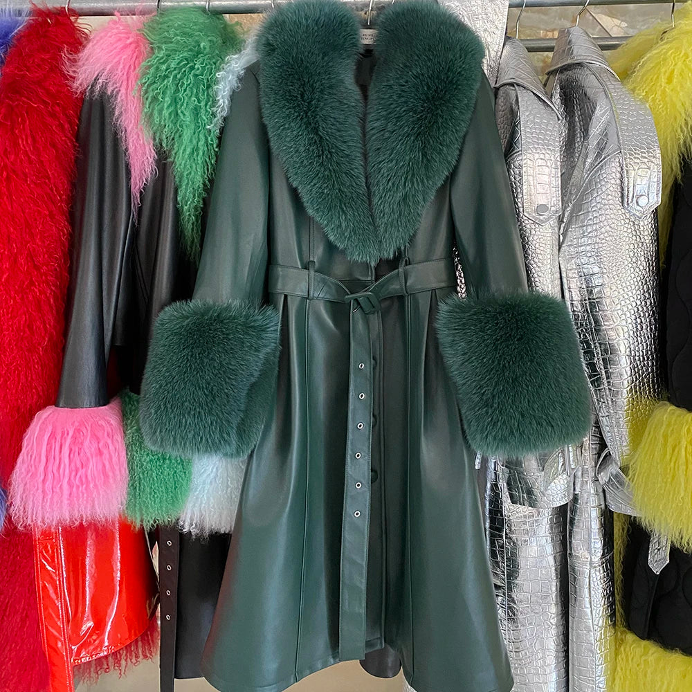 Green coat with fur trim hanging among other colorful coats.