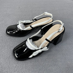 Another view of black patent slingback bow block heels