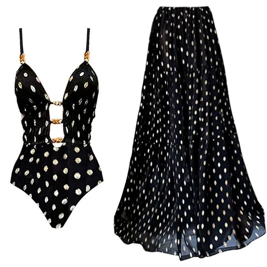 Black and gold polka dot bikini and matching maxi skirt laid out