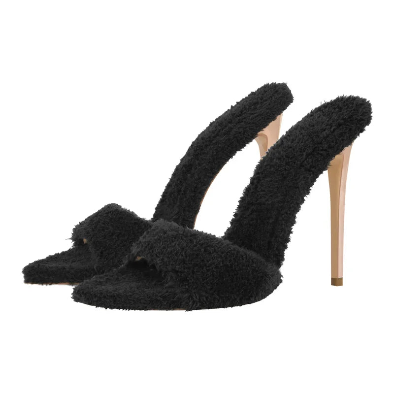 Close-up of green fluffy pointed toe stiletto heels